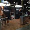 Warm wood-look interlocking flooring installed in a trade show booth