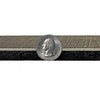 Side view of vinyl flooring and foam backing beside a quarter for scale