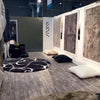 Gray wood-look vinyl flooring installed in an exhibit booth