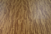 Assembled faux wood flooring surface and wood grain detail