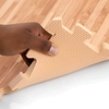 Flexible EVA foam backing on TSJ Economy faux wood flooring tiles